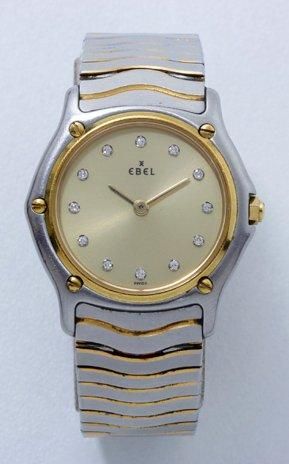 EBEL SPORT CLASSIC Montre bracelet de dame en acier, cadran doré avec index diamantés,...