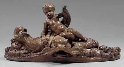 null Sculpture en chêne naturel représentant un putto tenant un dauphin dans un filet....