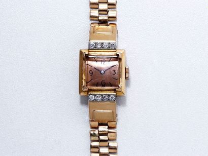 UNIVERSAL GENEVE POUR HERMES Montre bracelet de dame en or 18 K, cadran doré avec...