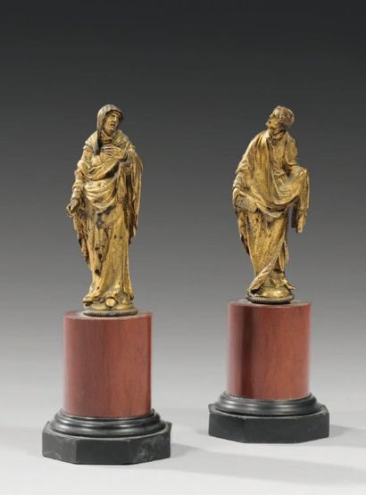null Paire de statuettes en bronze ciselé et doré figurant des personnages religieux...