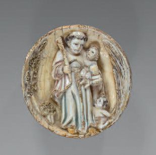 null Demi-sphère en ivoire sculpté représentant saint Antoine et l'Enfant jésus assis...