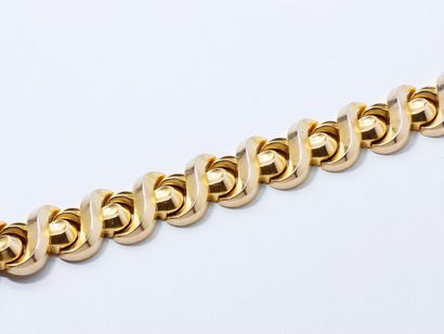 CLERC Paris 
Bracelet articulé en or 750 millièmes, composé de maillons à décor de...