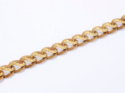 null Bracelet articulé en or 750 millièmes amati, composé de maillons ciselés à décor...