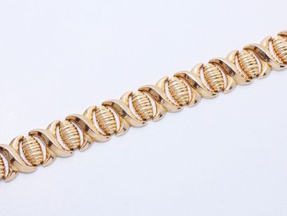 null Bracelet articulé en or 750 millièmes, composé de motifs godronnés partiellement...