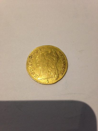 null Pièce en or Profil de Louis XVI datée 1786
Poids : 7.40 g.
