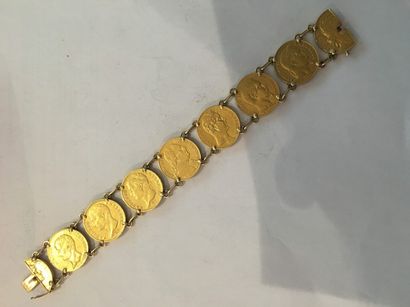 null 7 pièces de 20 Francs or montées en bracelet
Poids brut : 69.10 g.

