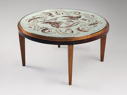 LELEU Jules (1883-1961) Table basse circulaire en hêtre et palissandre. Plateau en...