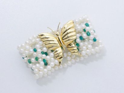 null Bracelet composé d'une tresse en perles de culture d'environ 5 mm et de rondelles...