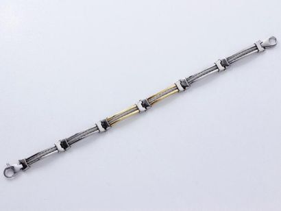 null Bracelet articulé en or 750 millièmes et acier composé de maillons galbés décorés...