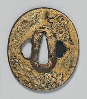 null TSUBA en laiton doré de chrysanthèmes et de vagues.
L: 7 cm
Japon, XIXème s...