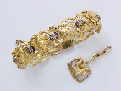 null Beau bracelet articulé en or 750 millièmes, composé de maillons décorés d’un...