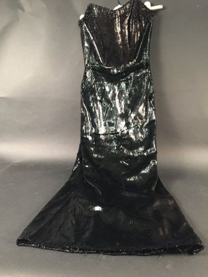 null Deux robes du soir Couture, vers 1940-1950.
Fourreau en taffetas noir souligné...