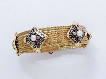 null Bracelet souple en or 750 millièmes composé de 5 rangs de chaîne tressée, décorés...