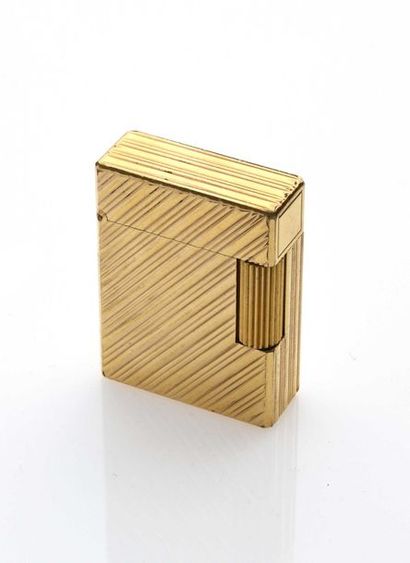 null ST DUPONT Gas lighter in 20 mic gold plated with perpendicularly gadrooned decoration....