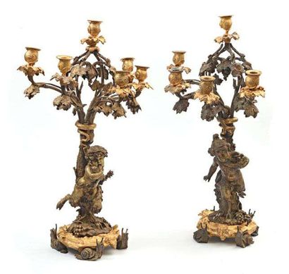 null Paire de candélabres en bronze à six lumières représentant un couple de faunes...