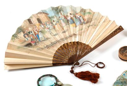 null Fan decorated with polychrome family scenes and a pastoral scene on the reverse....