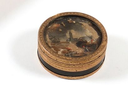 null Snuffbox in tortoiseshell surrounded by gilded metal, lid decorated with a miniature...