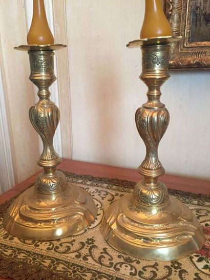 null Pair of gilt bronze candelabra, the summer with side torso, circular base, marked...