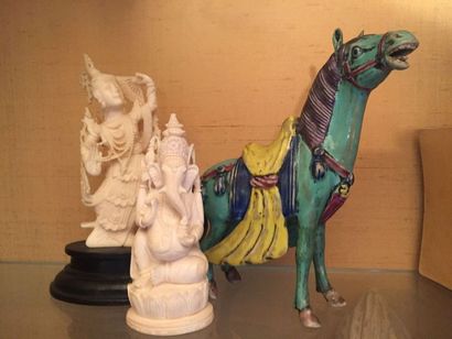 null Two imitation ivory figurines. Far East modern work. It is joined by a horse...