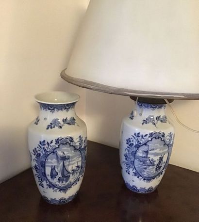 null Pair of porcelain baluster pots decorated with blue monochrome landscapes on...
