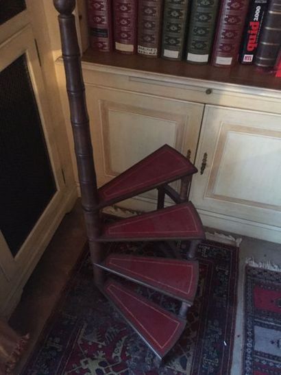 null Bookcase staircase in mahogany stained wood and red leather.