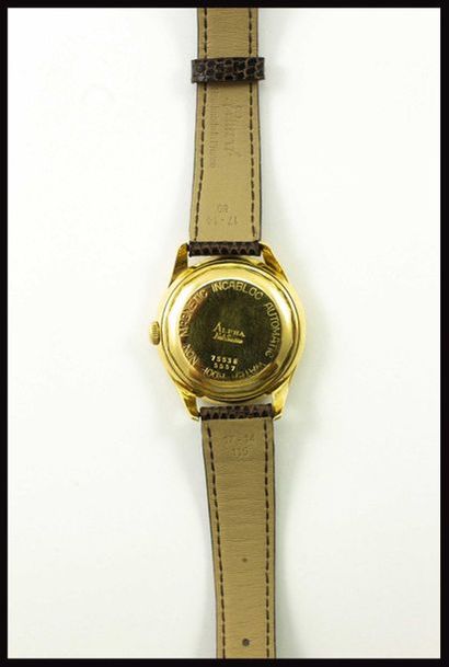 null Alpha Montre de ville en or jaune 18K 750 millièmes à mouvement automatique....