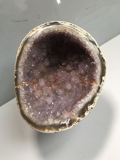 null Amethyst geode with a wooden base plate

Length: 23cm
