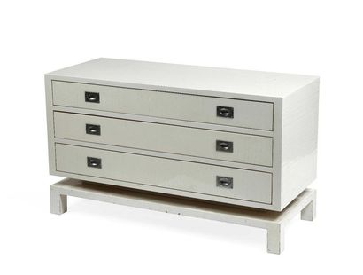 null Rectangular chest of drawers in cream lacquered wood opening by three drawers....