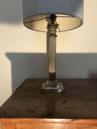 null Corinthian column in silver plated metal mounted as a lamp.