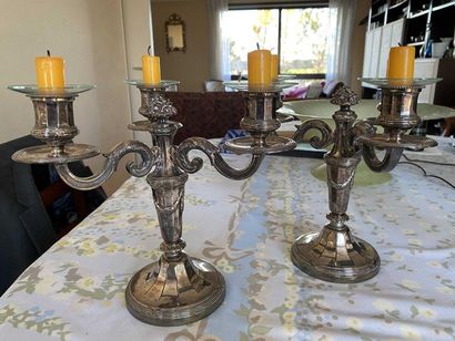 null Pair of silver metal candelabra with three light arms.