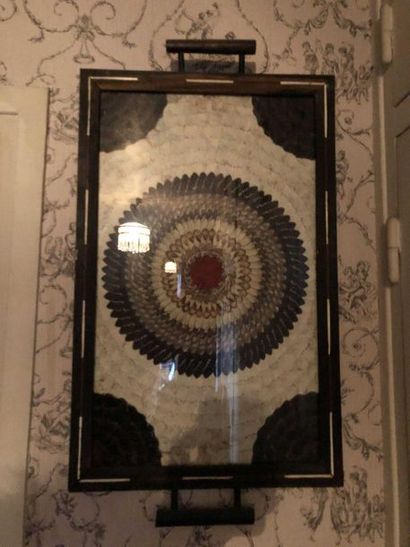 null Butterfly wings tray, blackened wooden medallion and tapestry in the center...