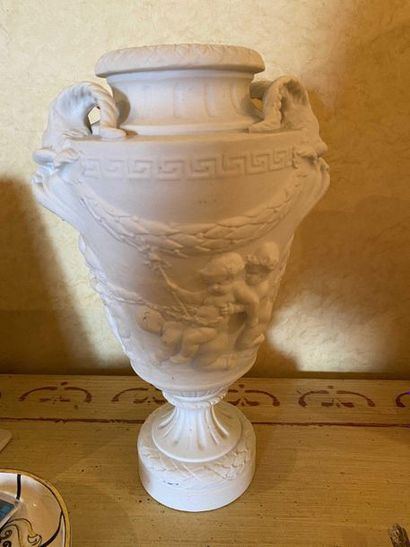 null Biscuit vase decorated with children playing after Clodion. Height 31cm