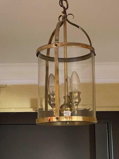 null Three cylindrical lanterns in gilded brass with three lights