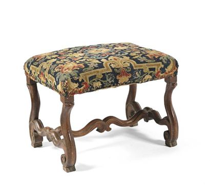 null Rectangular stool made of natural wood with sheep bone base covered with a tapestry...