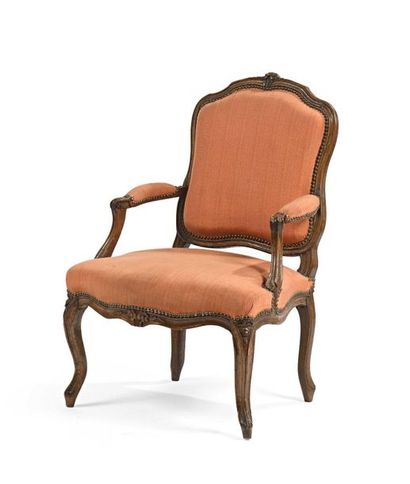 null Armchair with flat back in natural wood carved with flowers and mouldings, arched...