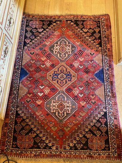null Wool oriental rug decorated with three medallions on a red background. 160x...