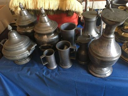 null Pewter set comprising a large pitcher, pewter measures, a large polylobate pitcher...