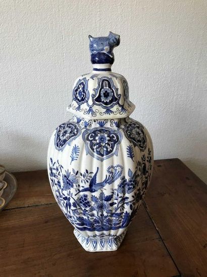 null Covered earthenware vase with ribbed body, blue and white decoration of trendy...