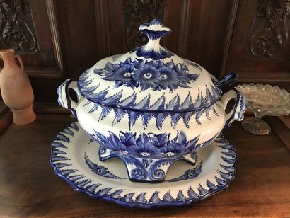 null Large tureen covered in blue earthenware on a white background and its ladl...