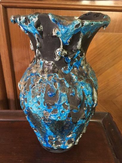 null Turquoise ceramic vase on black background.