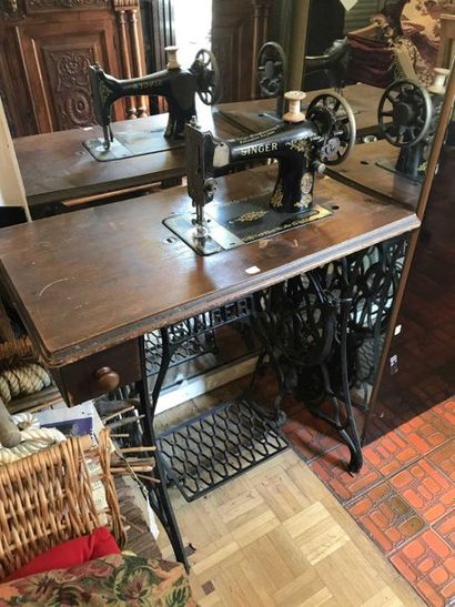 null Singer sewing machine and its cast iron stand