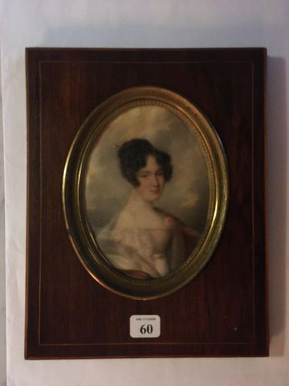 null 60 Miniature gouache on oval paper Young woman in bust in a rosewood frame....