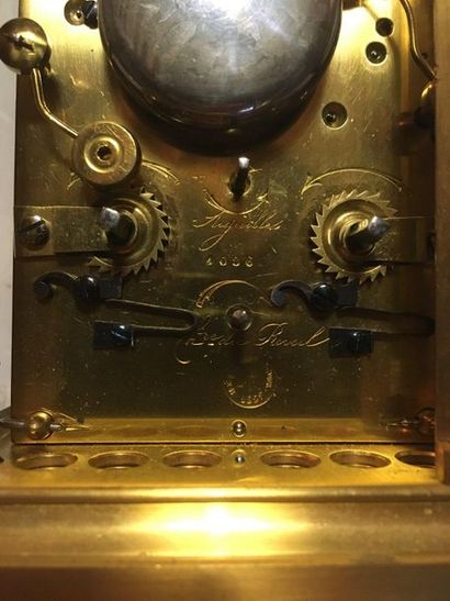 null 68 Réveil cage en bronze doré, le mouvement émaillé blanc signé Bourdin Ets,...