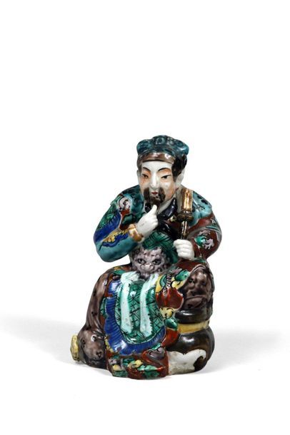 null 93 China Porcelain statuette representing a seated dignitary, polychrome decoration....