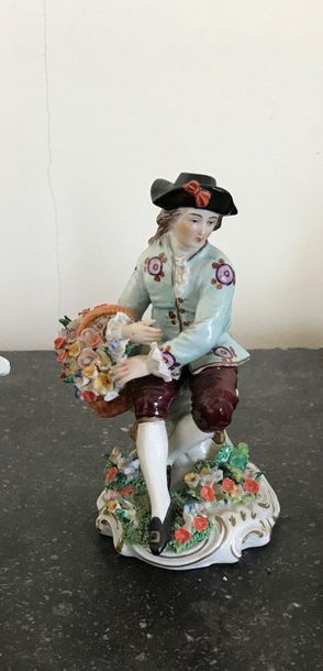 null Polychrome porcelain subject Young man with basket XIXth century Height :14.5cm...