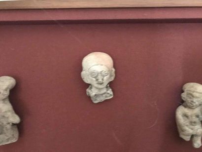 null Travel souvenir: two terracotta head ocarinas and three terracotta subjects...