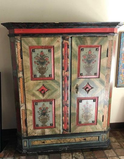 null Painted wooden wardrobe decorated with floral vases opening by two doors. German...