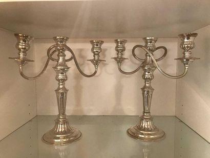 null Pair of silver metal candelabra with three arms of light. A slightly twisted...