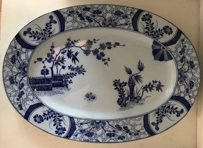 null Large oval porcelain dish decorated with flowering branches, the marli decorated...