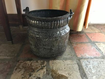 null Metal charcoal bucket with embossed decoration of stylized animals Height: 224cm...